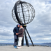 From Finland to Nordkapp, Norway: Our Road Trip to the North Cape 29 Couple Beneath the Arctic Globe Monument